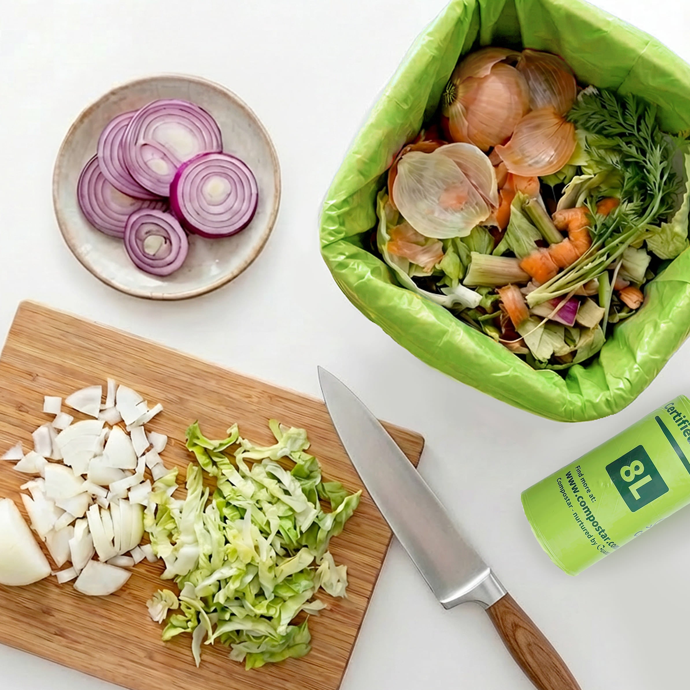 Roll of 8L FOGO Bin Liners fitting perfectly inside a kitchen caddy - Eco Friendly Food Scrap Bags ready for council green bins.