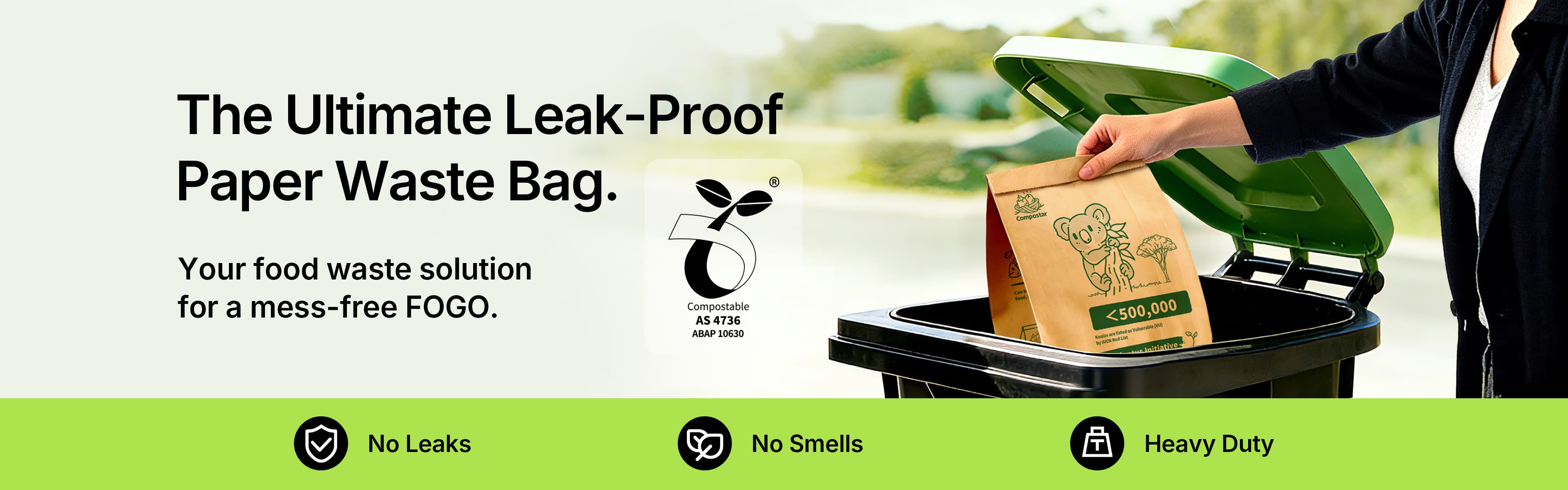 Compostar AS 4736 certified leak-proof paper bag being placed into a green FOGO wheelie bin for mess-free food waste disposal.