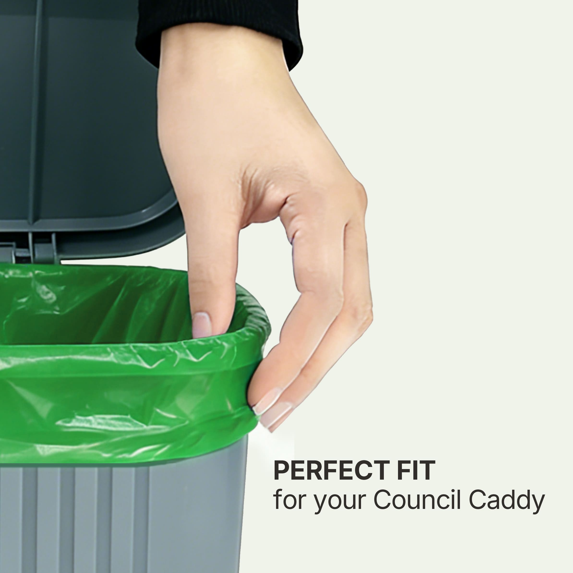 Hand demonstrating the perfect snug fit of a Compostar 8L compostable bin liner inside a standard small grey kitchen FOGO caddy. AS 4736 certified for green bins.
