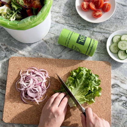 Eco-friendly 10L kitchen caddy liners on a benchtop for daily food scrap collection