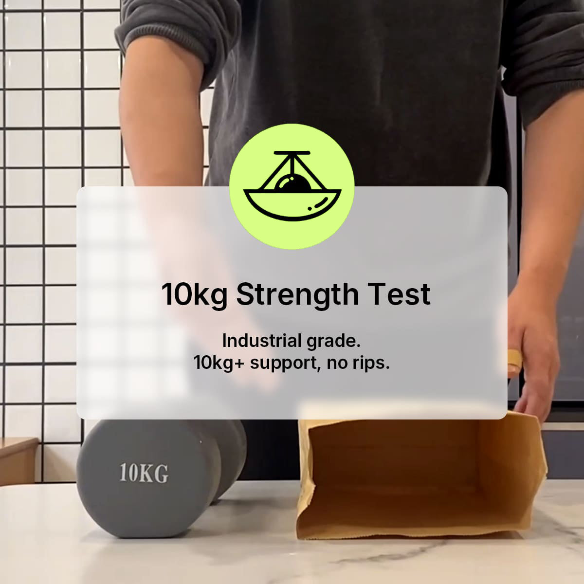 Load video: A Compostar FOGO bag holding a 10kg iron dumbbell during an industrial-grade strength test to prove it can support 10kg+ without ripping.